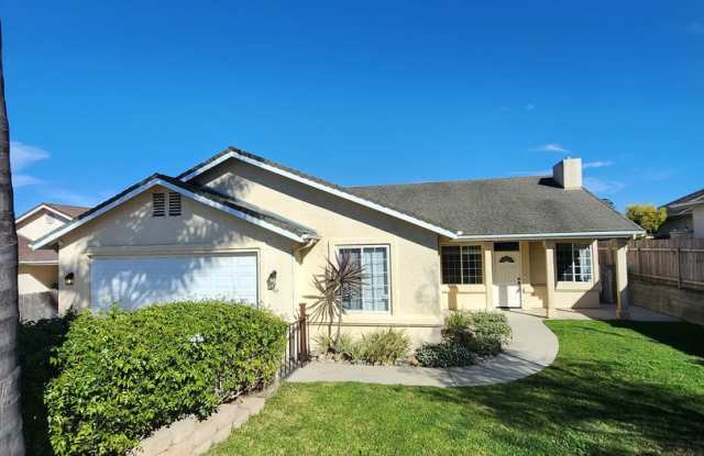 Gorgeous 4 Bed, 2 Bath Home with Large Garage and Fenced Backyard