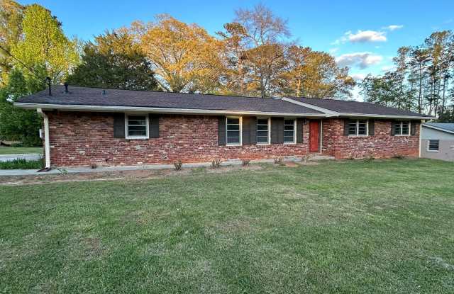 JUST LIKE NEW! Landlord just finishing up doing a total remodel on this 3 bedroom/2 bath home with large outbuilding. - 720 Jewel Place Southwest, Gwinnett County, GA 30047