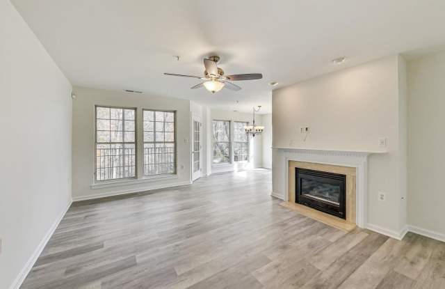 READY TO GO!!! Renovated 2BD/2BA with 1 Reserved Parking Space  screened in rear porch