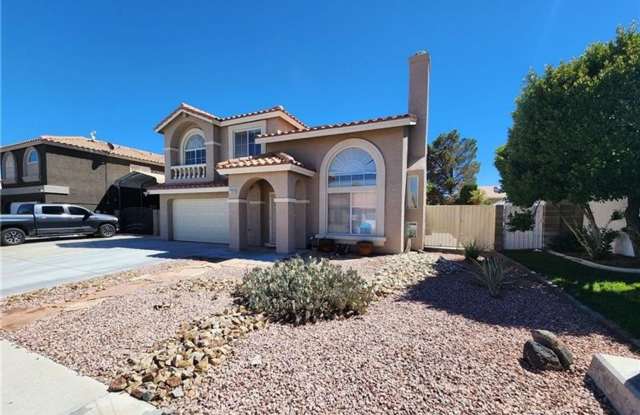 Beautiful two story home with a two car garage, covered RV gate, and dedicated RV parking.
