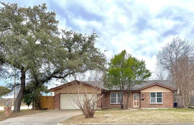 Modern and Charming 3 Bedroom, 1.75 Bath, 2 Living, 2 Car Garage Home with Covered Patio and Spacious Yard!