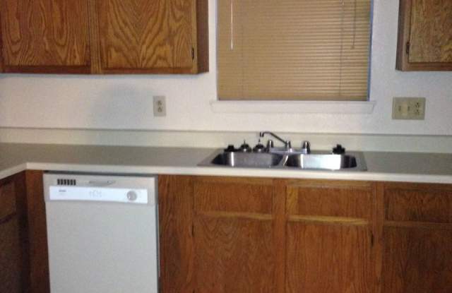 A FOURPLEX ON THE SHUTTLE ROUTE WITH PRIVACY FENCED YARD!!!