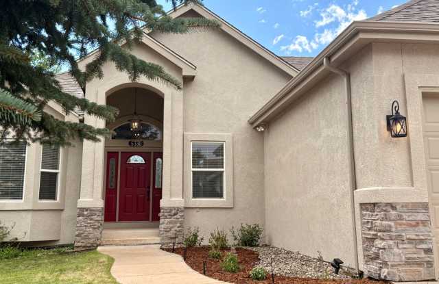 Stunning 5 Bedroom Walk-Out Ranch Style Home with Pikes Peak Views