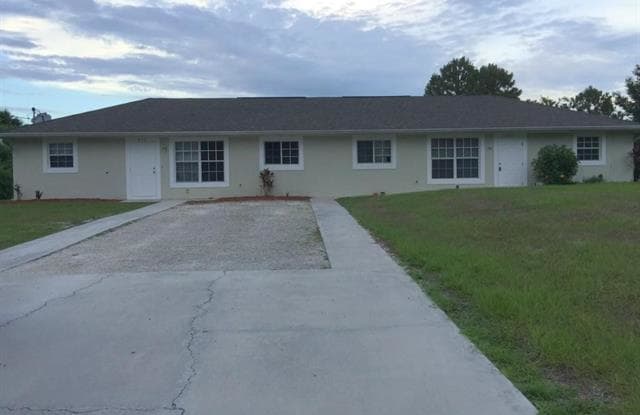 233 Meadow RD - 233 Meadow Road, Lehigh Acres, FL 33973