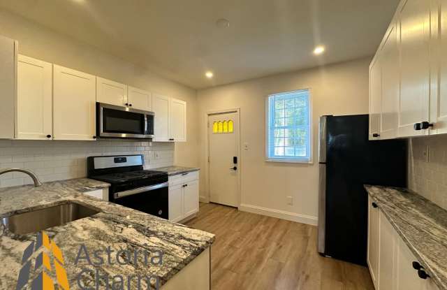 Photo of 3 Bedroom or 2 Bedroom with Den featuring Fenced Yard and Updated Kitchen