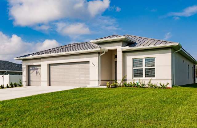 Canal Lot! New construction home offering 4 bedrooms 2 baths 3 car garage! fully fenced water view and preservation - 653 Wilmington Parkway, Cape Coral, FL 33993