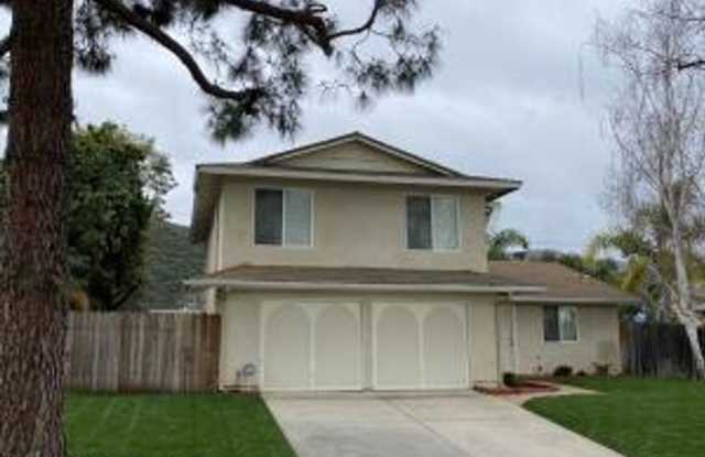 Photo of Welcome home! This spacious residence offers five bedrooms, three baths, and over 1,900 square feet
