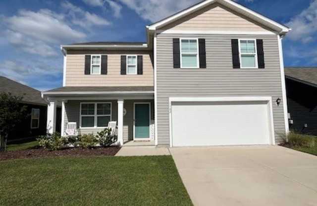 Discover this spacious 4-bedroom, 2.5-bath home in Winnabow, NC