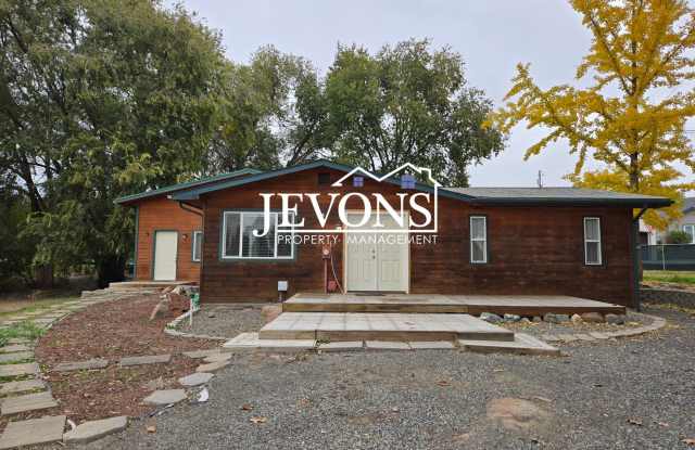 Photo of Move-in special: $500 off your first month’s rent. Cozy 4-bedroom home with a fully equipped kitchen, located in a quiet residential area in East Yakima - Convenient access to local grocery stores and markets!
