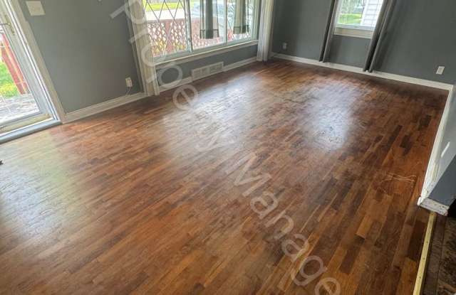 Photo of 4 Bedroom Home w/ Attached Garage and a Sun Room