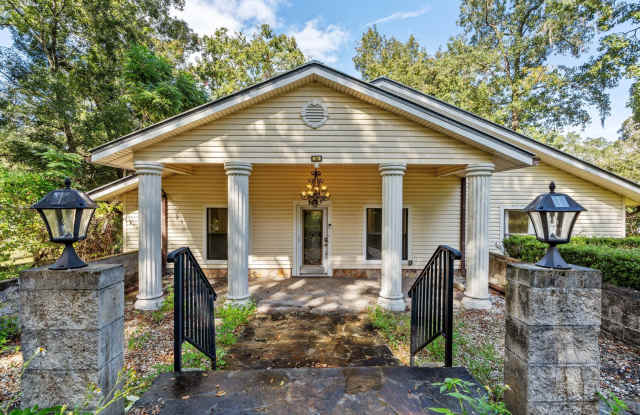 Beautifully updated 3-bedroom, 2-bathroom home situated on Lake Asbury, complete with a private dock, boat slip, and resident-only access to the Lake Asbury boat ramp
