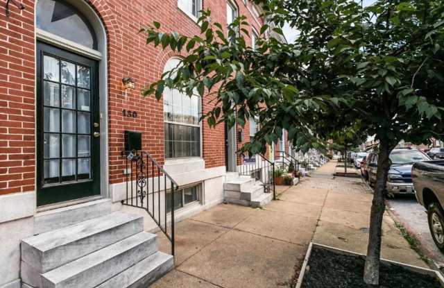 Charming 2bdrm 2.5 bath Patterson Park home with parking and rooftop deck
