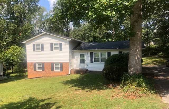 Travelers Rest !! 3 BR, 2 BA with Great Living Space - Den, Bonus Room, Primary Suite has a HUGE walk in Closet, Laundry Room, private screened in porch & deck AND a storage shed out back.  Fresh Paint and New LVP Floors