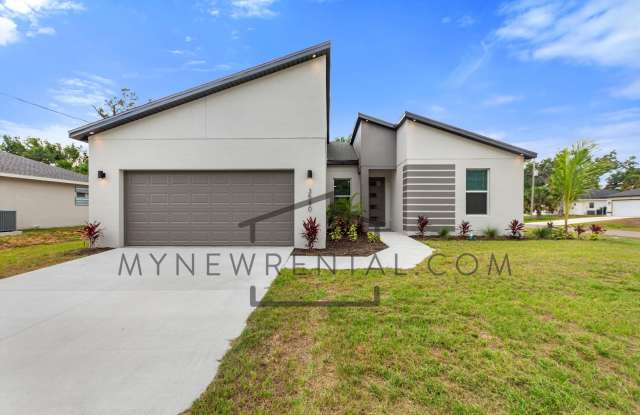 Photo of ONE MONTH FREE RENT! Modern, energy efficient home with ALL of the upgrades! North Port, FL
