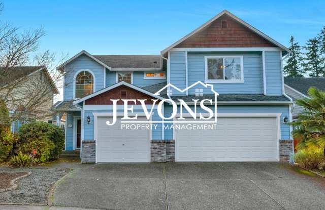 Photo of Spacious 4-bedroom home with fully equipped kitchen, 3-car garage, and easy highway access!