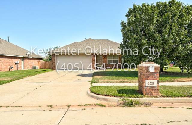 Charming Mustang Home with Garage, Fenced Yard & Modern Amenities