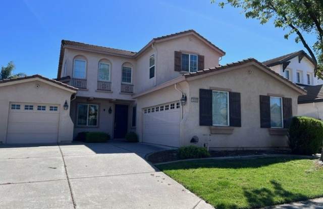 Elk Grove home with fresh paint, close to schools, parks and shopping. - 10085 Annie Street, Elk Grove, CA 95757