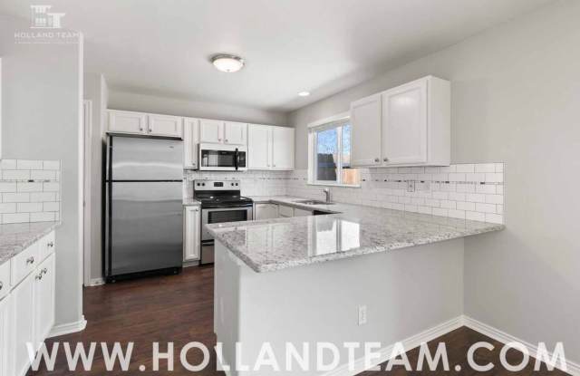 Updated home on large corner lot in Centennial!