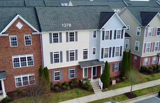 Walk to Bonefish & Target from this like new multi-level 4 bedroom, 3.5 bath townhome!