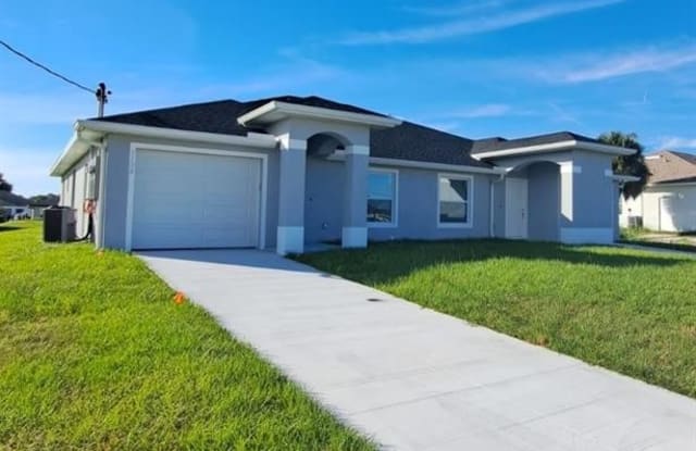 1128-1130 Harry AVE S - 1128 Harry Avenue South, Lehigh Acres, FL 33973