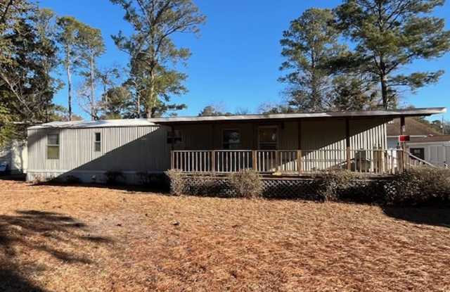 Welcome to this charming 2-bedroom, 1.5-bathroom home located in the desirable area of Leland, NC