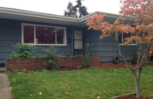 Huge 5 bedroom South Campus home with 1,000 sq. ft. garage - available July 11th!