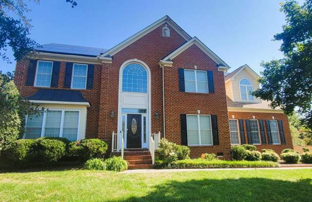 Stately brick front contemporary on huge corner lot.