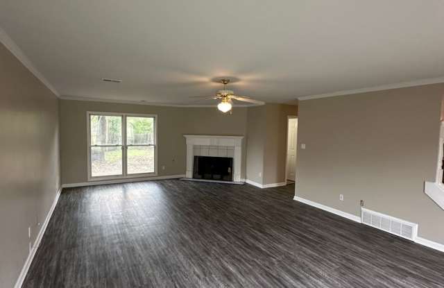 Huge 3 BD Home On A Corner Lot! Fully Fenced In Back Yard! New Paint and Flooring!