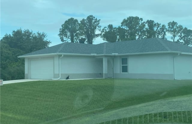 810 Porter Street E - 810 Porter Street East, Lehigh Acres, FL 33974