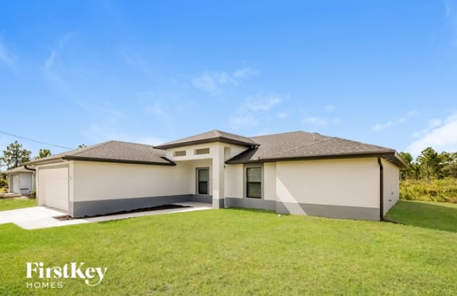 915 Plumosa Avenue - 915 Plumosa Avenue, Lehigh Acres, FL 33972