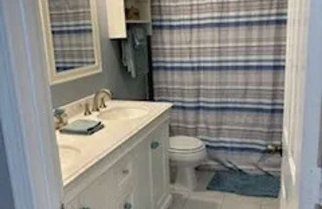 Room in 4 Bedroom Home at Milpass Dr