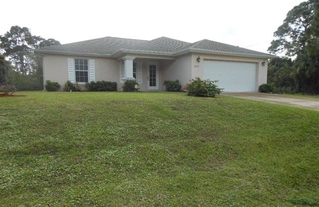 1222 Howell ST E - 1222 Howell Street, Lehigh Acres, FL 33974