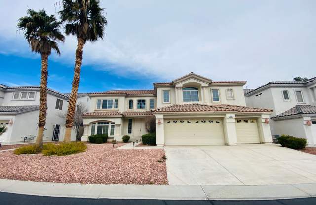 This Rhodes Ranch home has new paint through out, an open-concept kitchen and family room with a separate dining and living room, and a covered patio at the backyard. - 28 Living Edens Court, Spring Valley, NV 89148