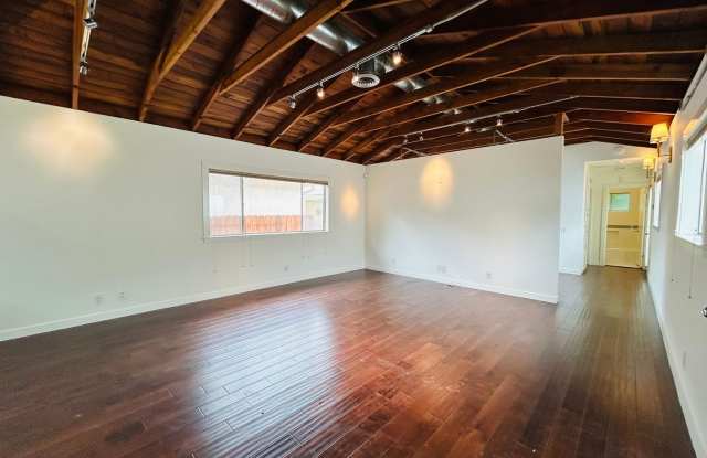 Spacious One Bedroom + Den Backhouse! In Unit Laundry! Prime Location!