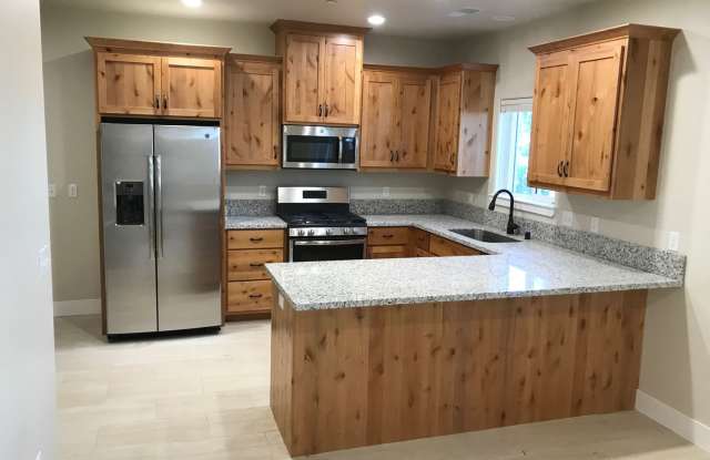 Newly Built Home with 3 (Yes 3) Primary Suites complete with full Bathroom in ideal location!