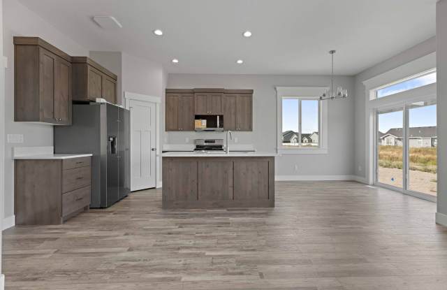 NEW HOME with large garage stalls and unfinished basement for additional storage