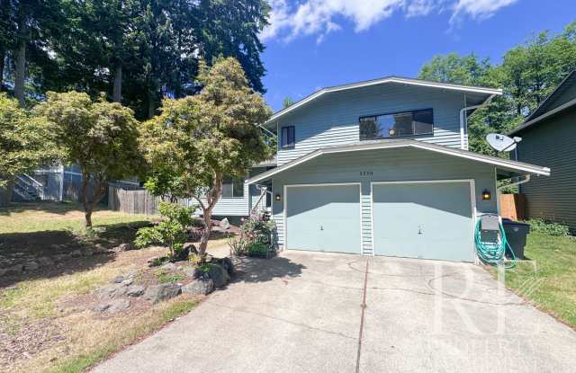 Spacious Poulsbo Home with Large Basement, Fenced Yard & Garden Space