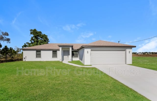 1121 Elegans St E - 1121 Elegans Street East, Lehigh Acres, FL 33974