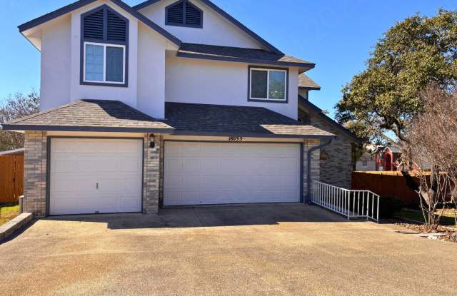 Spacious 4 Bedroom Stone Oak Home with Three Car Garage