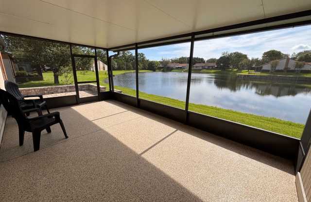 2 Bed 2 Bath Luxury Waterfront Townhome with Screened Lanai & Garage!