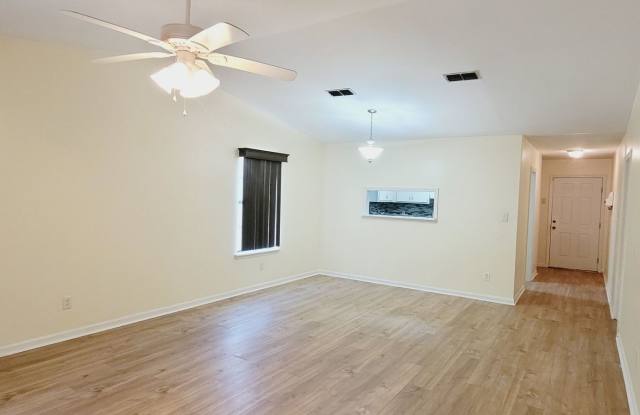 LOVELY 2/2 w/ Stainless Steel Appliances, Washer/Dryer, Deck, Fenced Yard,  Plank Vinyl Floors Throughout! Avail February 1st for $1275/month!