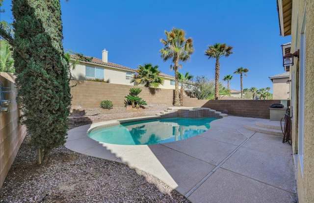 Great 2 story home with sparkling pool, located inside Guard Gated Southern Highlands!