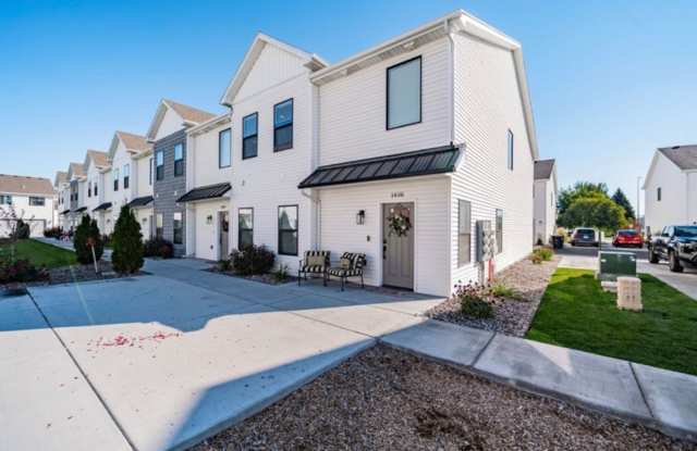 AWESOME END UNIT with attached 2 stall garage and additional personal parking spot on the exterior