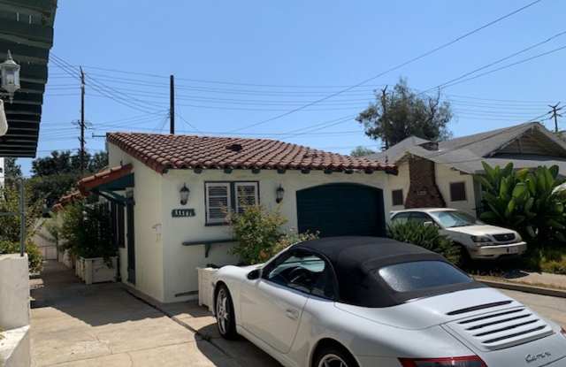 Bungalow - 1 bedroom + Office = natural wood floors, mini split a/c , new appliances, private patio, 1 parking space with EV charger