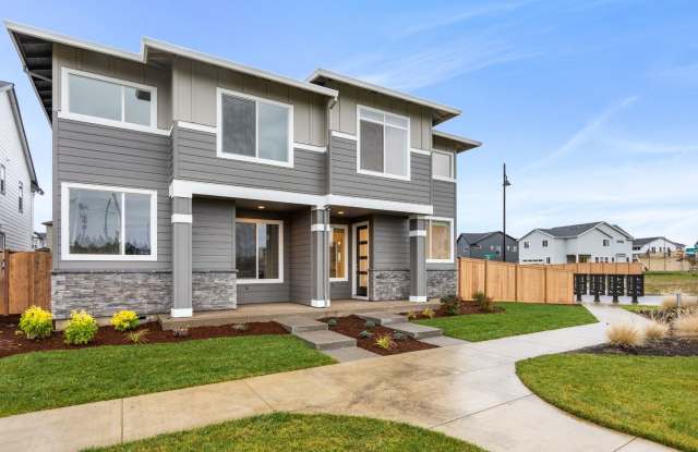 Modern 2025 Construction End Unit Featuring Open-Concept Living, Contemporary Kitchen  Two-Car Garage