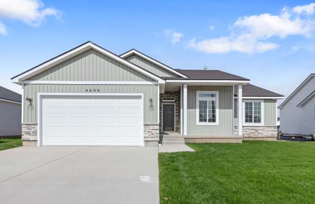 Photo of NEW HOME with large garage stalls and unfinished basement for additional storage