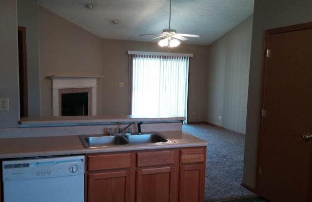 Wake up to a stunning pond view in this beautiful 2 BD 2BA duplex with a 2 car attached garage