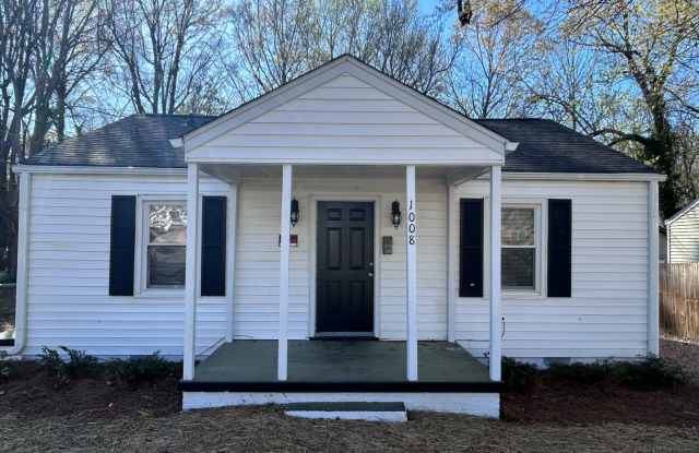 Great central Greensboro location with a detached 2 car garage space! Near UNCG