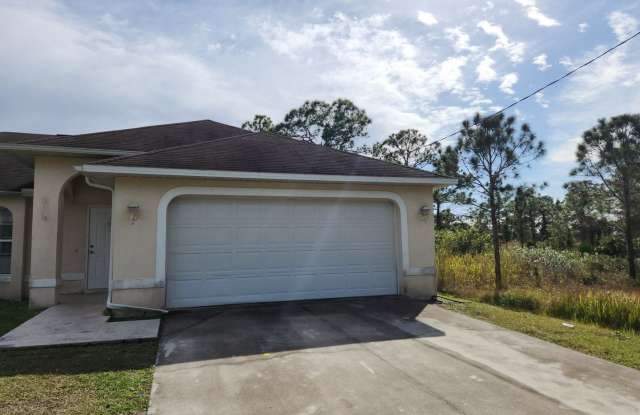 1038 Candlelight Drive - 1038 Candlelight Drive, Lehigh Acres, FL 33974