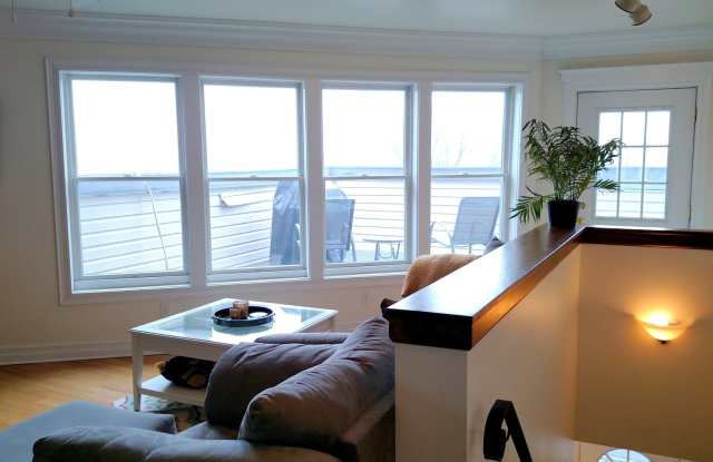 Photo of Move-in Special: FIRST MONTH’S RENT FREE!! Beautifully Remodeled 2 Bed/ 2Bath House W/Rooftop Deck - Off Street Parking - Central AC - Hardwood Flooring